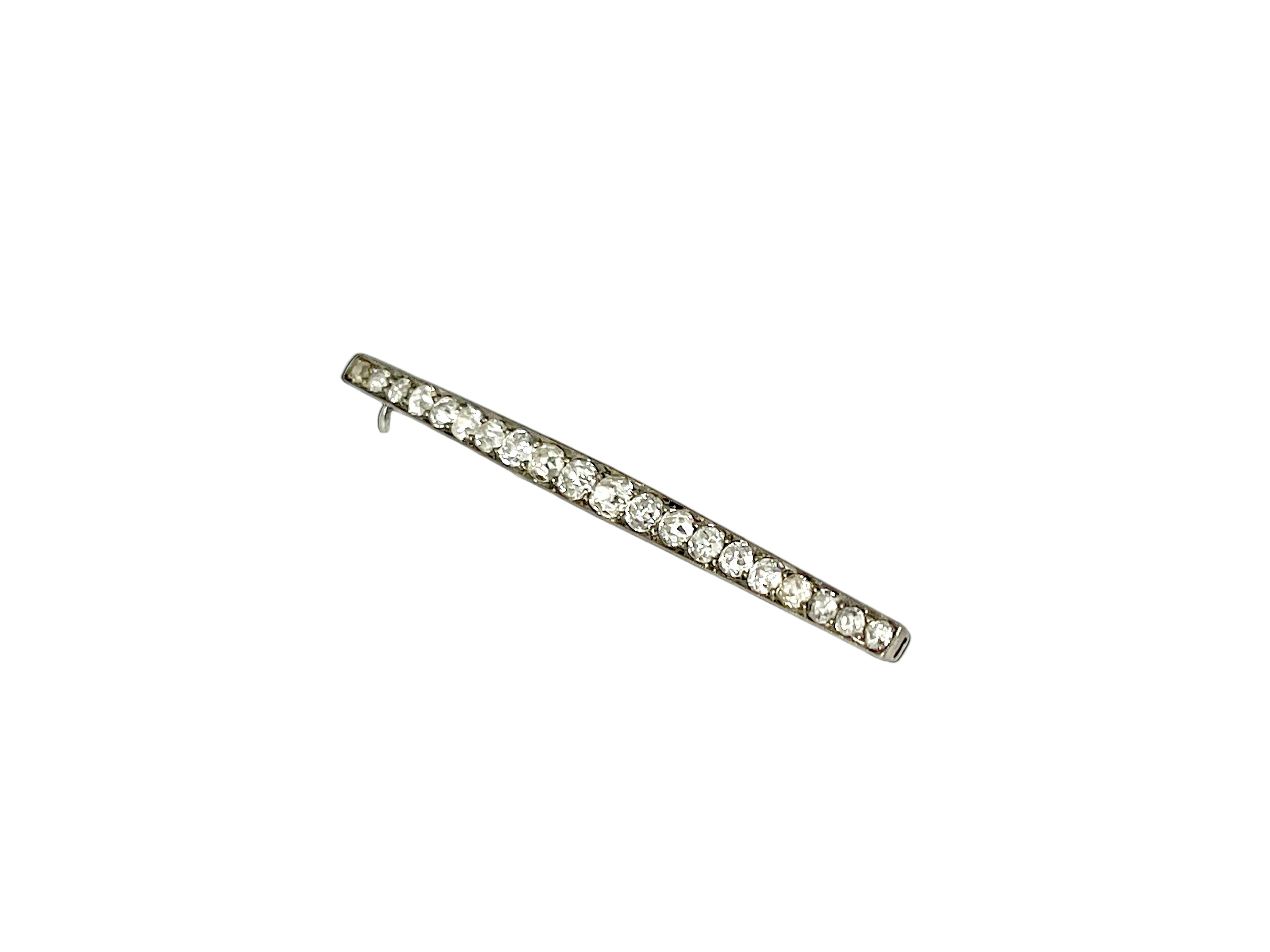 Diamond bar brooch on a white background