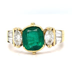 An Emerald and Diamomd 18ct Gold Ring