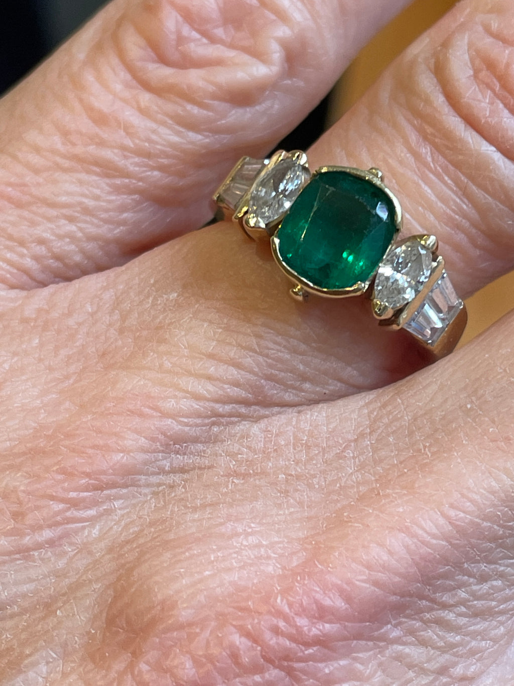 An Emerald and Diamomd 18ct Gold Ring