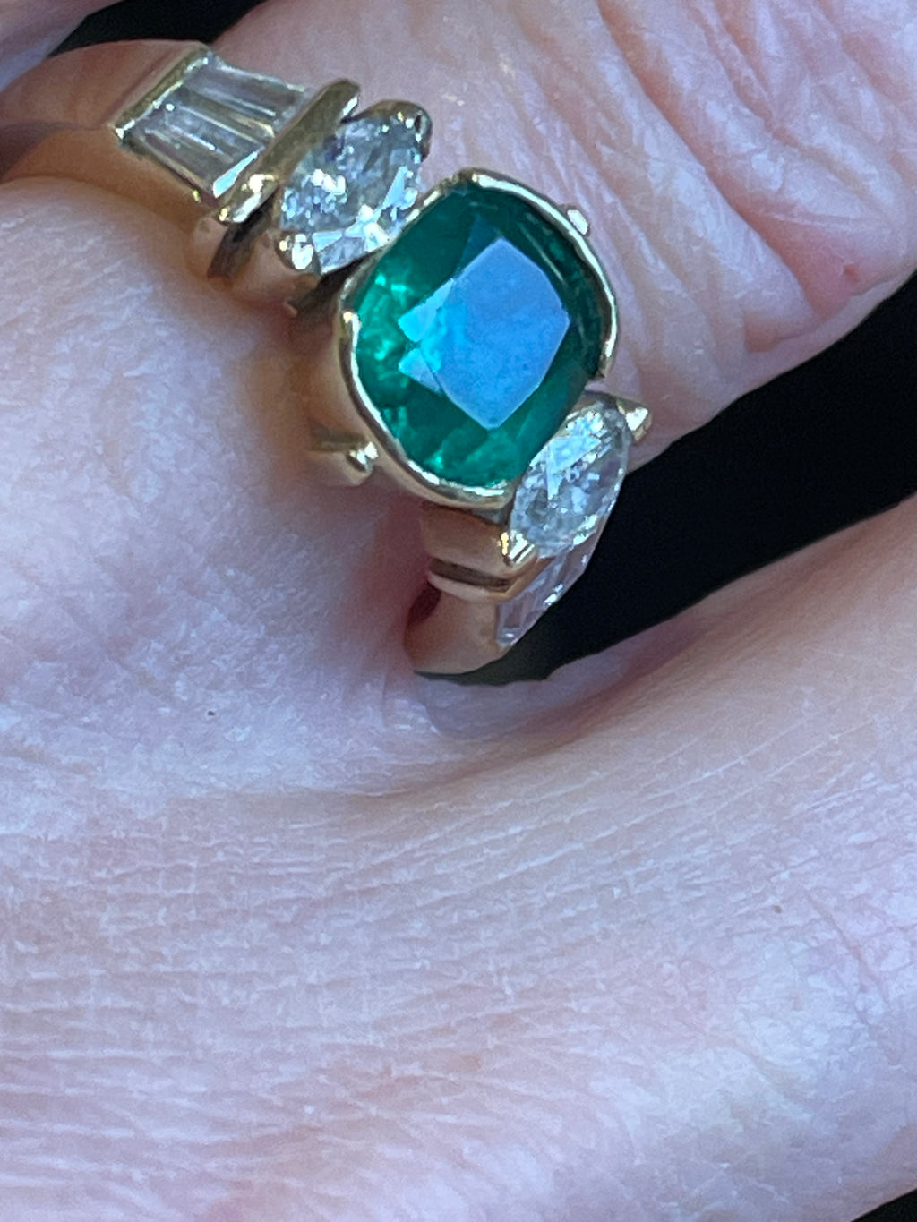 An Emerald and Diamomd 18ct Gold Ring