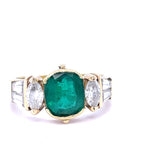 An Emerald and Diamomd 18ct Gold Ring