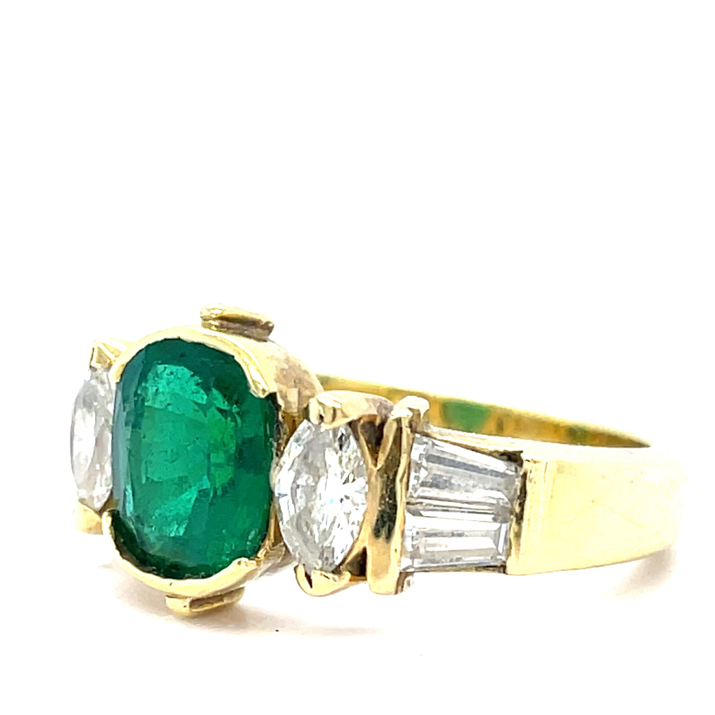 An Emerald and Diamomd 18ct Gold Ring
