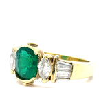 An Emerald and Diamomd 18ct Gold Ring